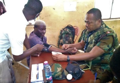 Alhaji Hammed Yussuf, Yendi Municipality Chief Executive being attended to by Major Randy Nii Ofori, the Medical Team Leader